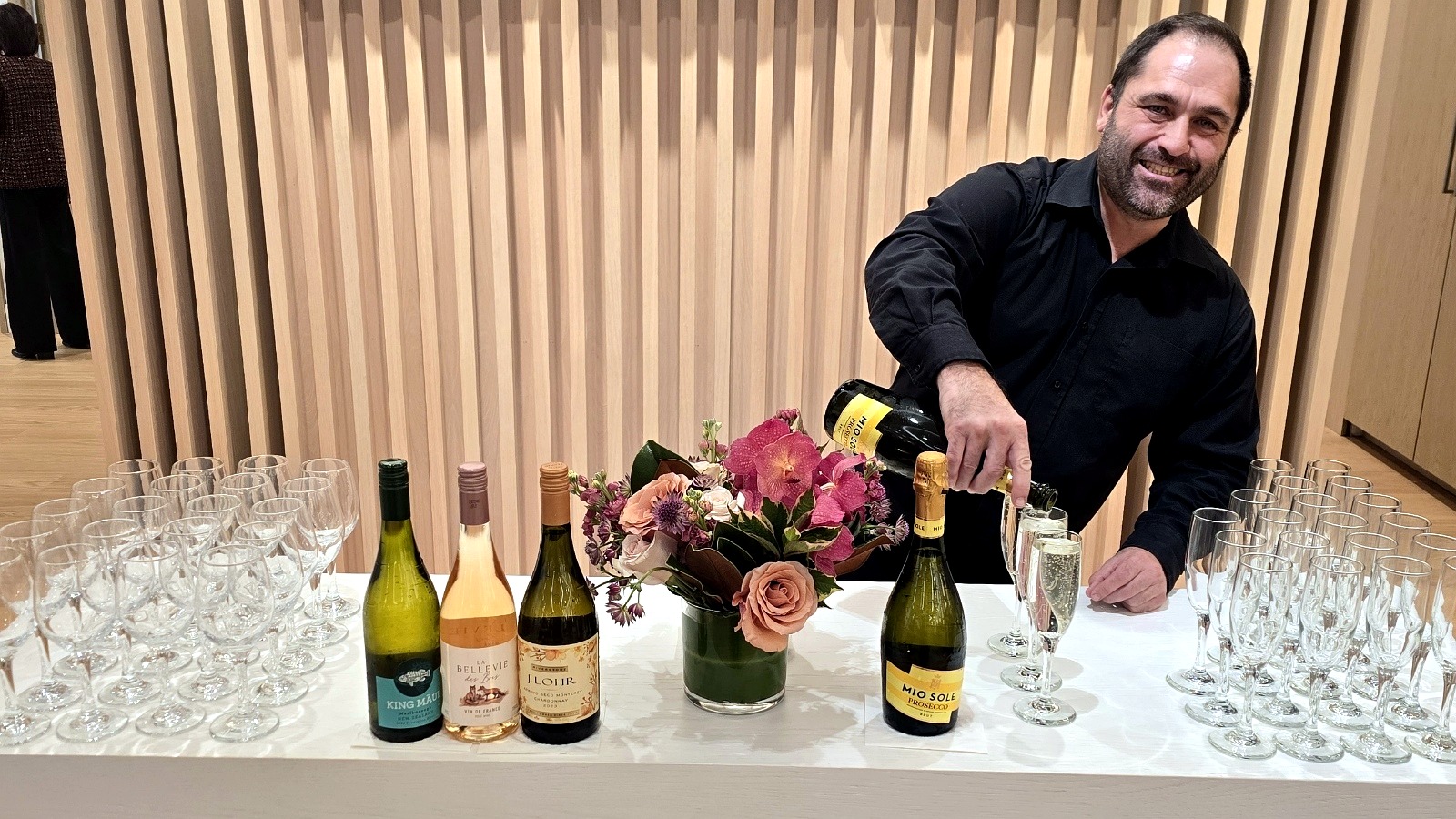 Bartender pouring champagne at a Fairfield County event.
